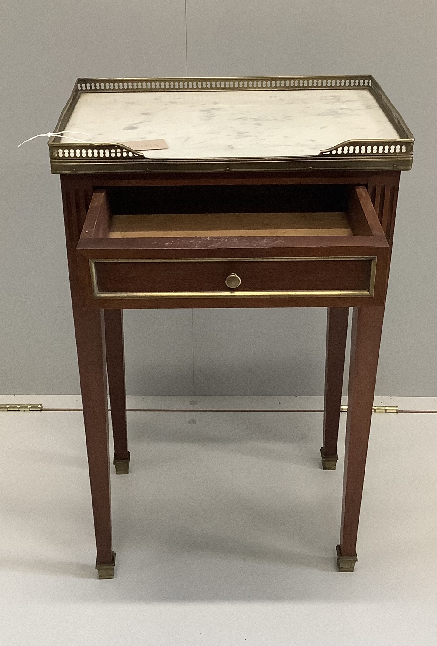 A French gilt metal mounted marble topped mahogany bedside table, width 42cm, depth 29cm, height 68cm